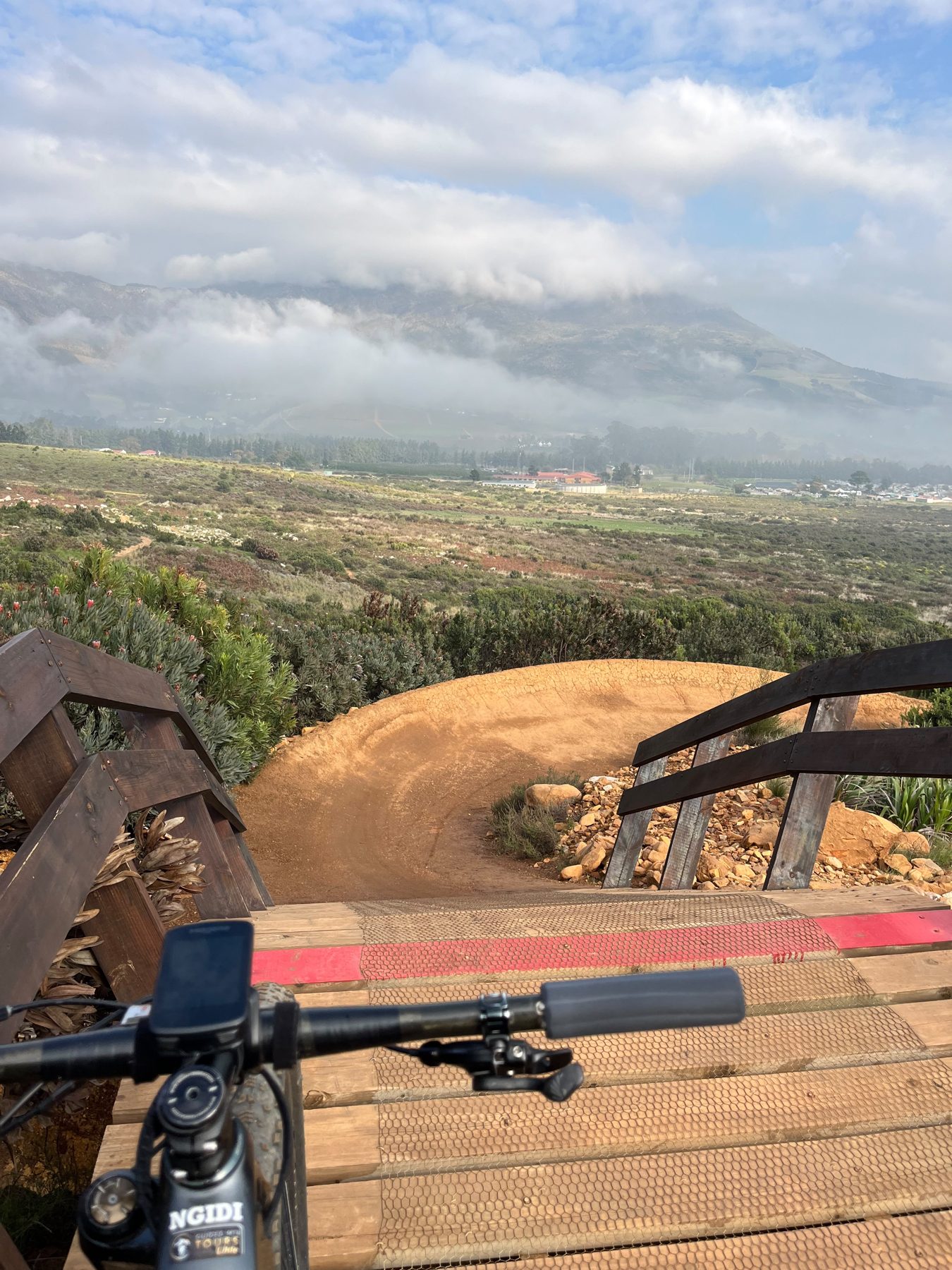 Wooden berm feature on a vineyard mountain bike trail in Stellenbosch