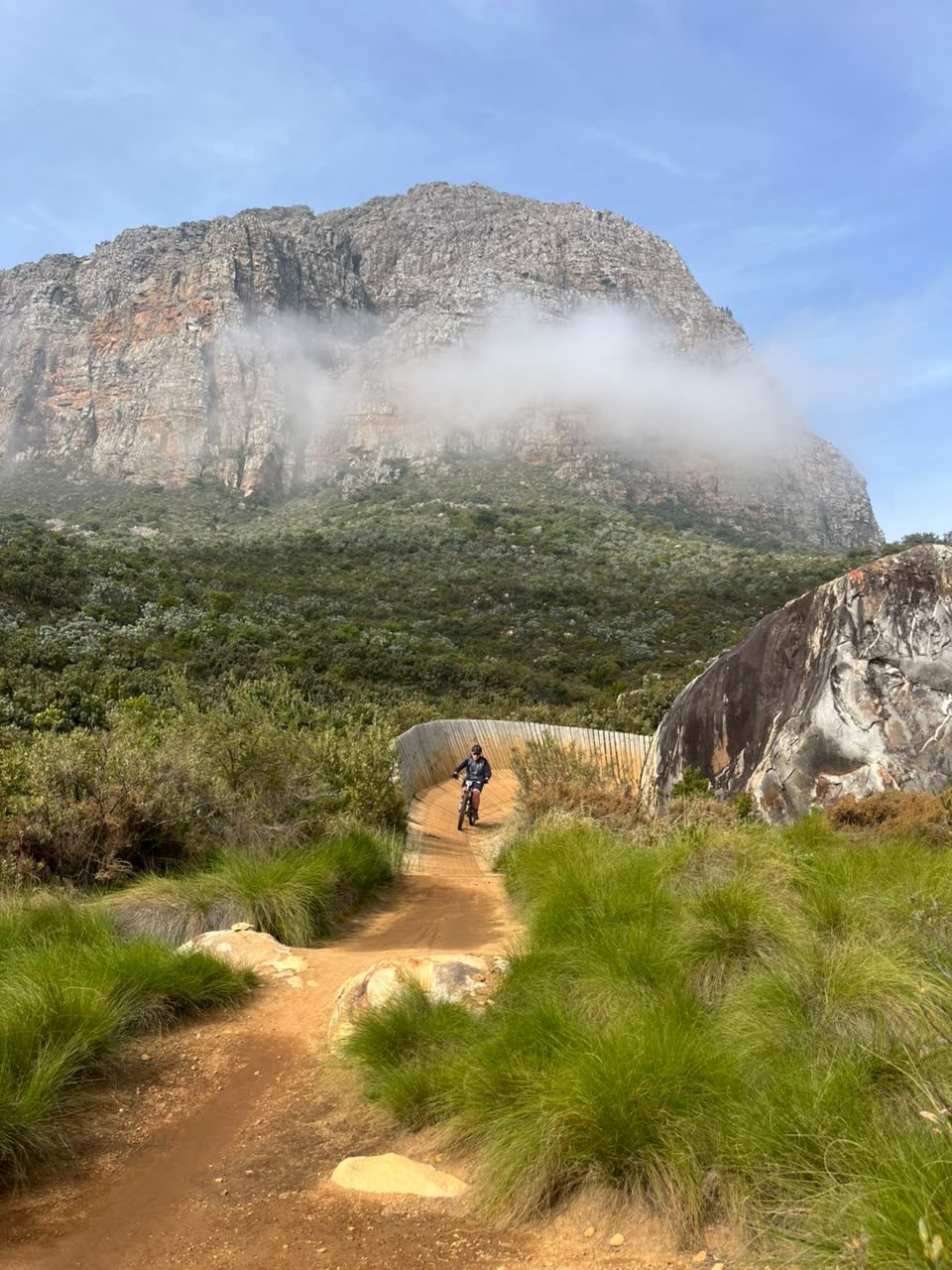 Rider climbing a rocky mountain trail in the Jonkershoek valley, Stellenbosch